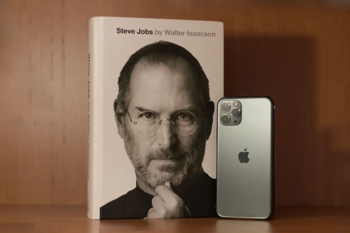 Steve Jobs book by Walter Isaacson (book cover and iPhone)